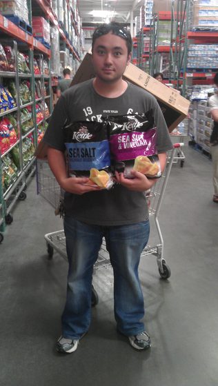 Before: at Costco holding two family bags of chips