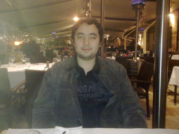 Before: sitting hunched forward at an outdoor restaurant