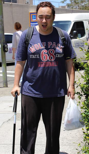 Before: walking down the street with a cane